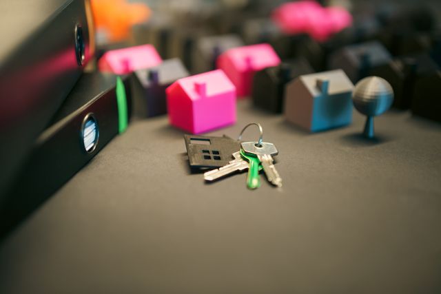 house keys and small house figurines